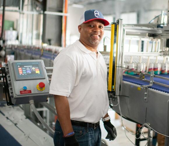 American Canning employee works with Gusto