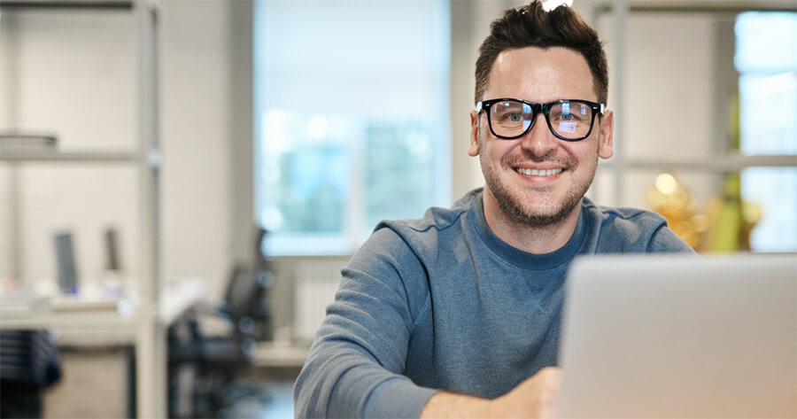 A person works at a laptop