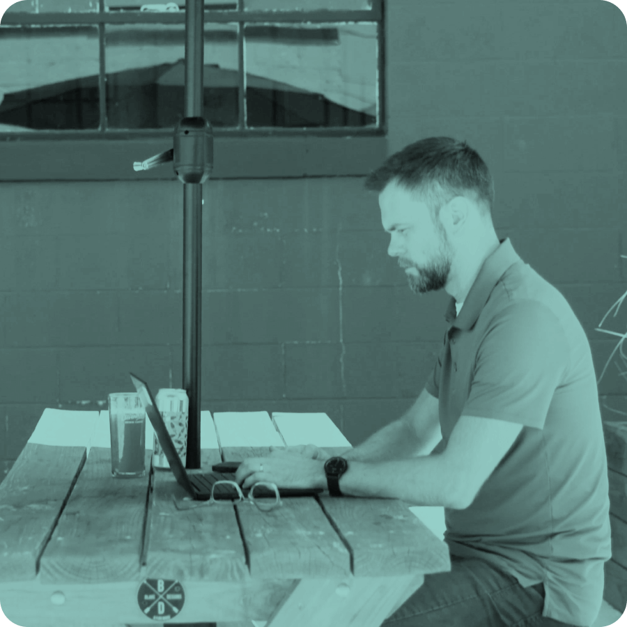 Jonathan Wise focuses on his laptop