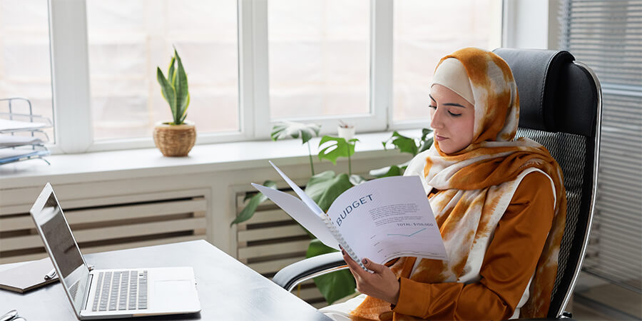 A person works on some files.